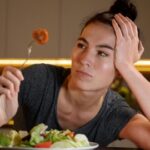 woman_trying_to_eat_healthy_at_home_da177c1cffe7e7a94e26a060e77805e3_480x270